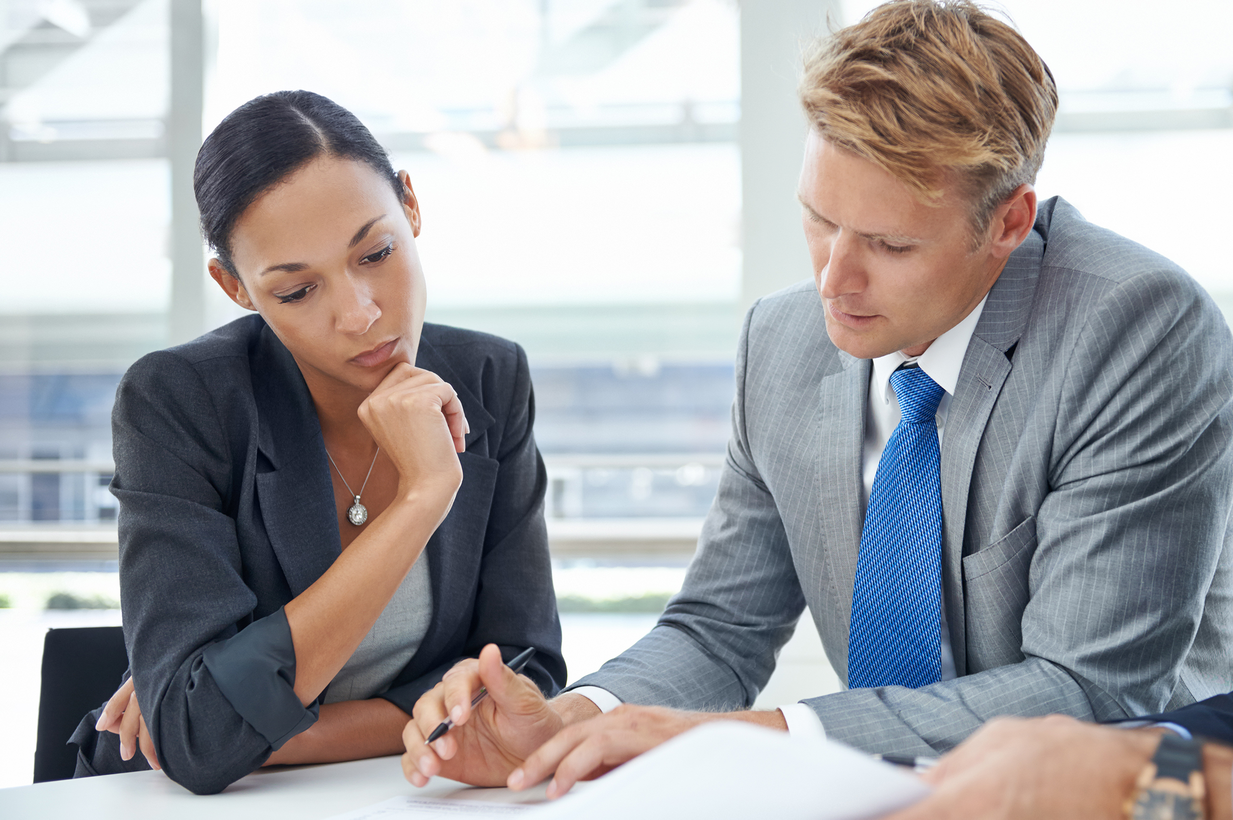 Reviewing,Their,Assets,And,Liabilities.,Shot,Of,Businesspeople,Looking,Over
